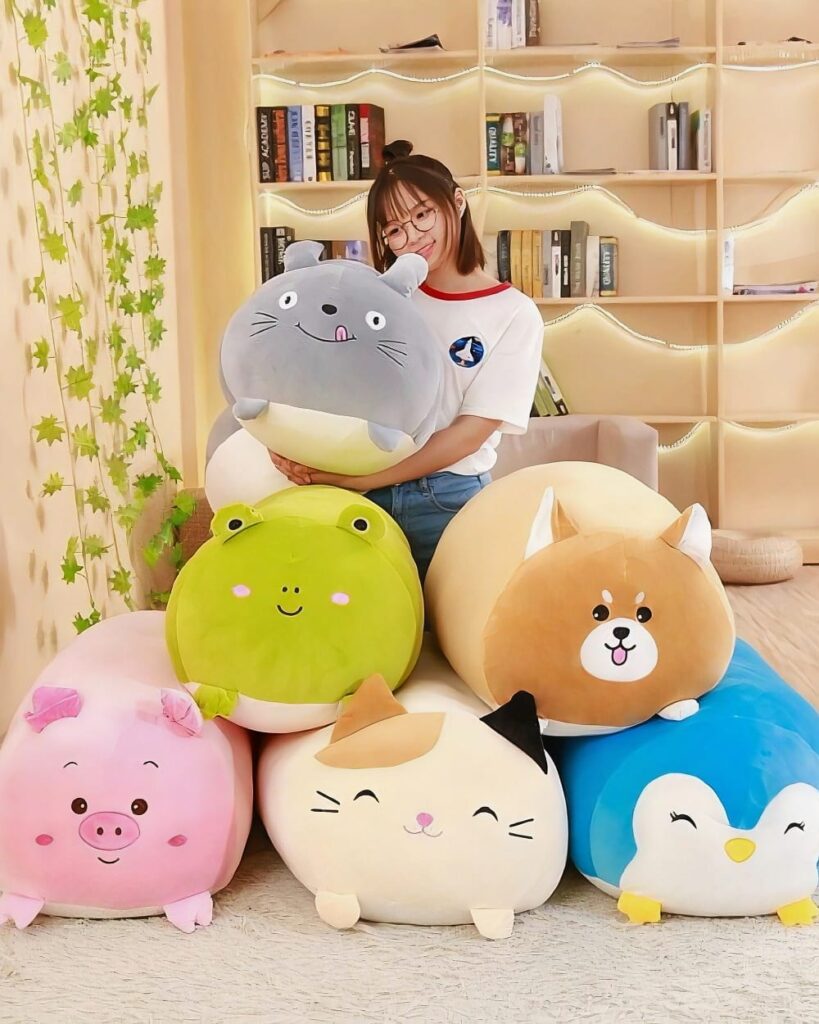 Assortment of kawaii animal mochi plushies: pig, cat, dog, and more.