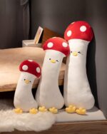 Set of long vegetable plushies – Gourmet Edition, featuring mushroom-shaped plushies with red caps and smiling faces.