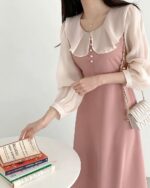 Pink puff sleeve french aesthetic dress, long-sleeved, with button detailing.