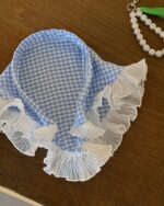 Retro triangle headscarf with gingham print and ruffled trim.
