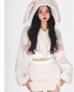 Model wearing bunny hooded plush pajamas, a cozy kawaii outfit.