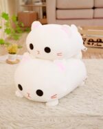 Kawaii milk cat plushie, a soft and cuddly white plush toy with black eyes and whiskers.