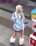 Person wearing a Loose Thick Feathered Hoodie - Harajuku Aesthetic with white fluffy hood and matching boots.