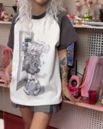 Saggy animecore aesthetic shirt featuring a character illustration on a short-sleeved t-shirt.