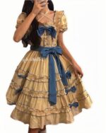 Vintage yellow french lolita dress with layers, bows, and lace details.