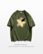 Olive green t-shirt featuring a kawaii scaredy-cat t-shirt design with stars and cute characters.