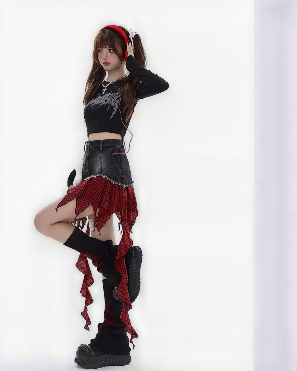 Woman wearing a punk plaid denim skirt with distressed details and combat boots.