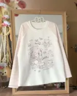 Nyanko Pink T-Shirt, pastel pink long-sleeved cutecore aesthetic top with kawaii illustrations.