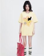 Yellow t-shirt featuring a 'scaredy-cat t-shirt' design with kawaii characters.