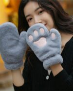 Gray neko paw winter gloves on a person's hands, featuring a plush paw design.