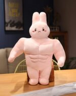 Pink buff bunny plushie with a muscular build and cute face.