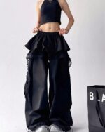 Black y2k cargo pants with lace details and a ruffled skirt. Unique fashion pants.