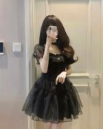 Black aesthetic vintage dress with puffed sleeves and a sweetheart neckline.