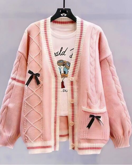 Pink kawaii bow sweater with cable knit detailing and button accents.