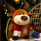 Cute brown reindeer christmas plushie decor displayed near a Christmas tree.
