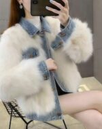 White faux fur coat layered over a light wash denim jacket. Y2k aesthetic denim coat.