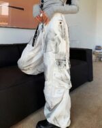 Washed out y2k artsy pants, wide-leg style with an artistic print, featuring multiple pockets.