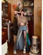 Long y2k aesthetic skirt with cut-out details, showcased in a casual outfit.