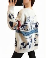 White cat cardigan sweater with vintage-style cat illustrations and text.