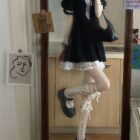 Black puffy dress with lace details, dark kawaii aesthetic style.