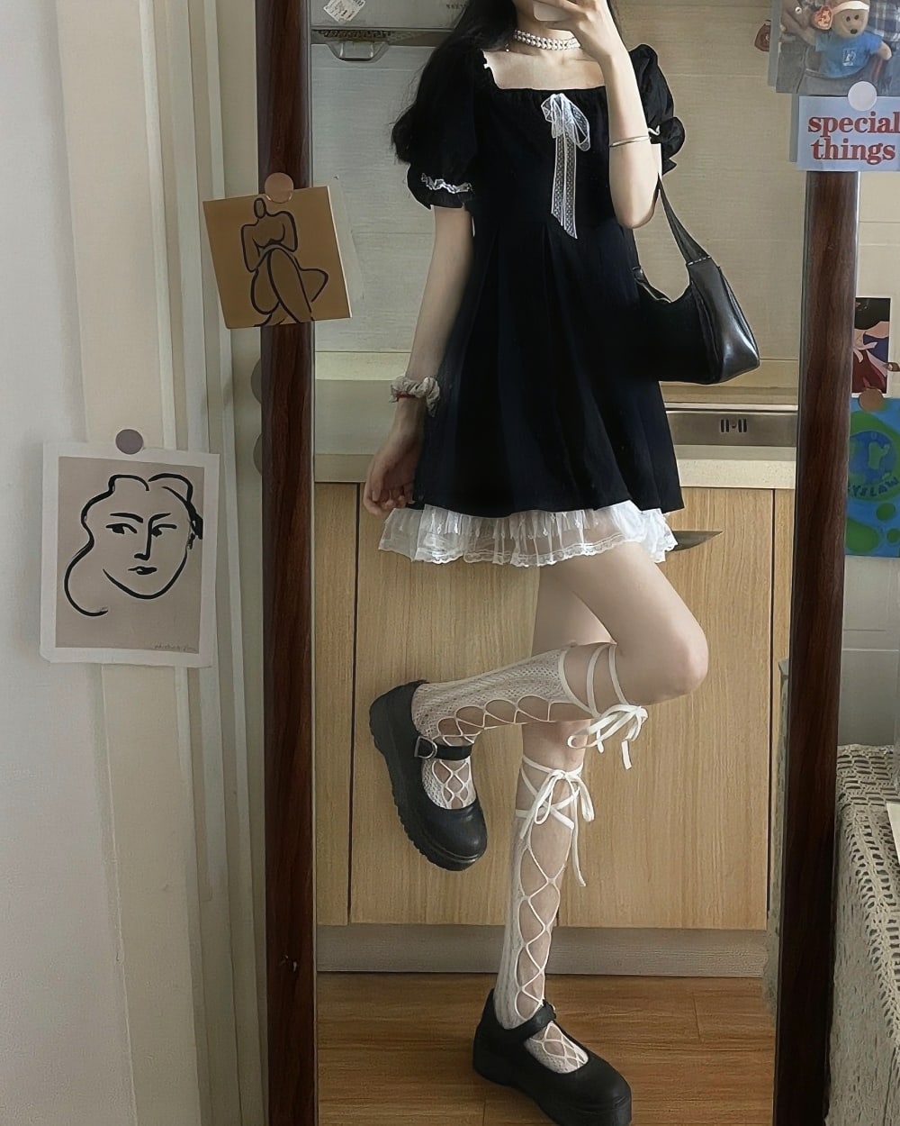 Black puffy dress with lace details, dark kawaii aesthetic style.