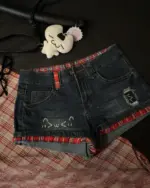 Dark wash kawaii denim shorts with red plaid lining and Y2K details.