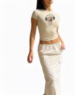 Cream Jam Cat t-shirt featuring a cartoon cat wearing headphones.