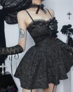 Black gothic aesthetic dress with lace detailing and straps.