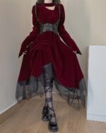 Red velvet gothic aesthetic dress with corset and sheer layers, waist-up view.