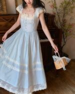 Light blue cottagecore aesthetic dress with lace details and puff sleeves.