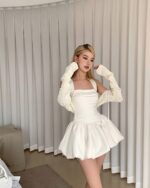 White sleeveless collar dress, a coquette aesthetic dress, with matching knitted sleeves.