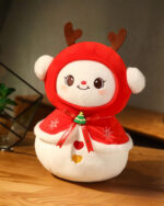 Kawaii Christmas plushie – a red and white reindeer character with a cute face and festive attire.