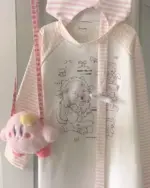 Nyanko Pink T-Shirt white top with character design and sleeves.