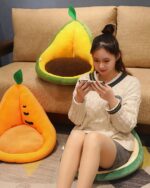 Kawaii fruit cushion featuring an orange and green pineapple design, plush seat.