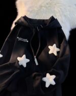 Black harajuku hoodie with star embellishments and a zipper.
