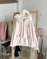 Pink Loose Little Lamb hoodie kawaii, displayed on a hanger with plush sheep ears.