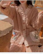 Pink kawaii plush pajamas set with buttons and plush embellishments. Cozy and soft.