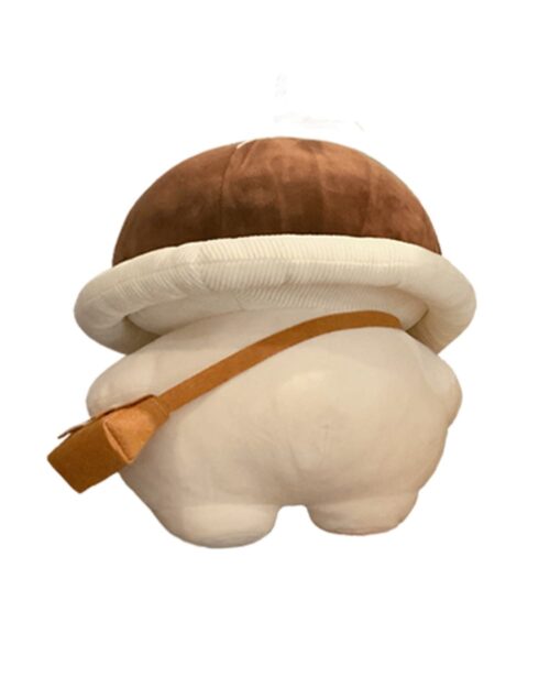 Close-up of a mushroom homunculus plushie, featuring a brown cap and white stem.