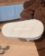 Bottom view of kawaii cat slippers with a textured sole and size details.