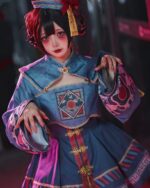 Model wearing a blue and pink jiangshi lolita costume with intricate details and accessories.