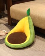Kawaii fruit cushion depicting a plush avocado shape with a padded seat.
