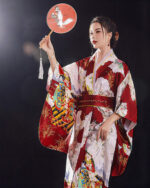 Detailed satin japanese kimono featuring floral and bird motifs, with a traditional design and wrap-around belt.