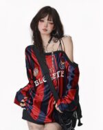 Red and blue off shoulder sweatshirt with ‘BLE CETTE’ lettering, coquette aesthetic style.