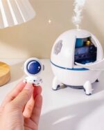 Kawaii mini spaceship humidifier featuring an astronaut figure and cool mist output.