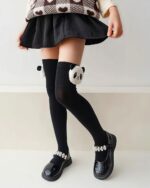 Black kawaii animal stockings with a panda design, JK Edition.