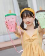 Two kawaii fruit bottles, one pink watermelon and one mint popsicle, with straps.