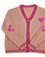 Peach-colored kawaii embroidered sweater with heart and star appliqués.