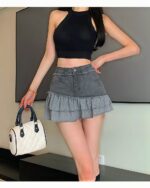 Ruffled denim skirt with y2k aesthetic details. Retro style, layered tiers, and distressed edges.