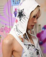 White sleeveless punk hoodie featuring star and galaxy print, grunge aesthetic design.