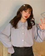 Light blue vintage aesthetic shirt with a ruffled French collar.